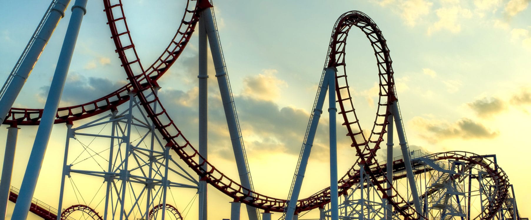 An elevated amusement attraction structure of the kind JE builds maintenance access for