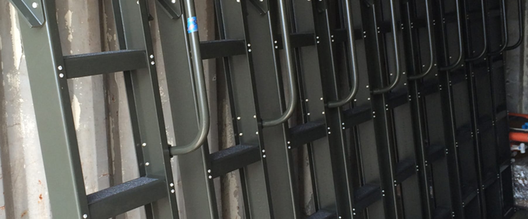 A run of JE fixed access ladders installed on facility infrastructure