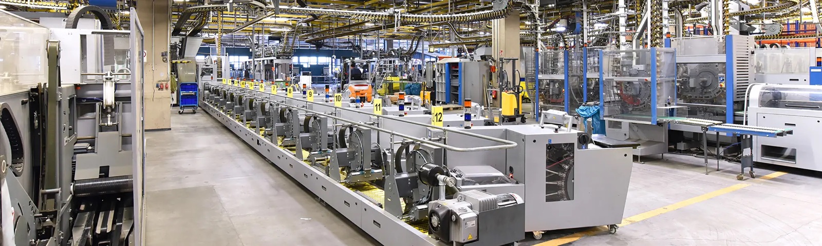 A guardrail-protected walkway over industrial equipment